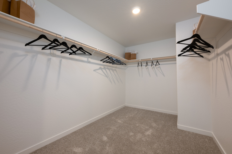 A room with a white wall and a white wall with a black drawing on it.