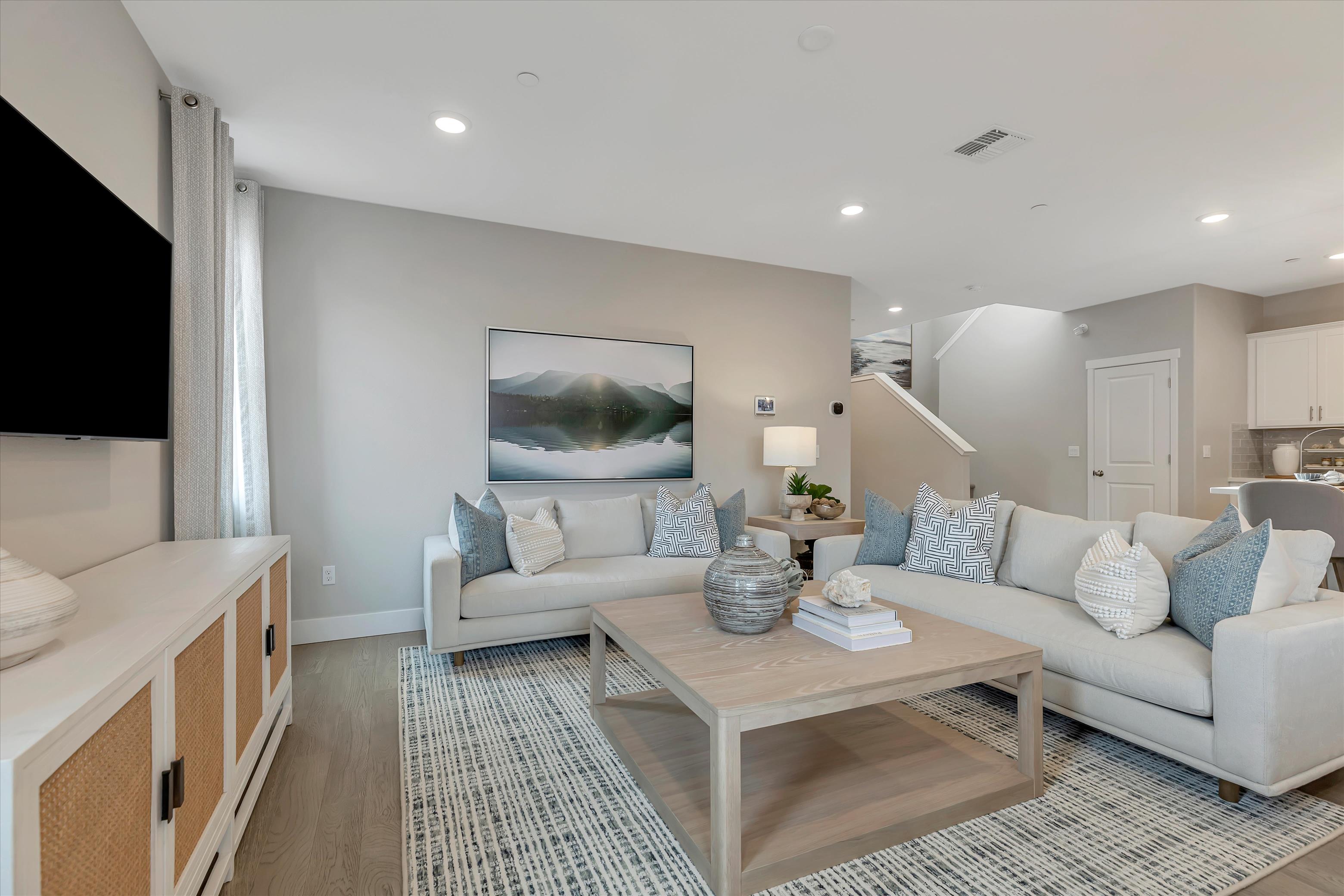 A living room with a couch and a coffee table.