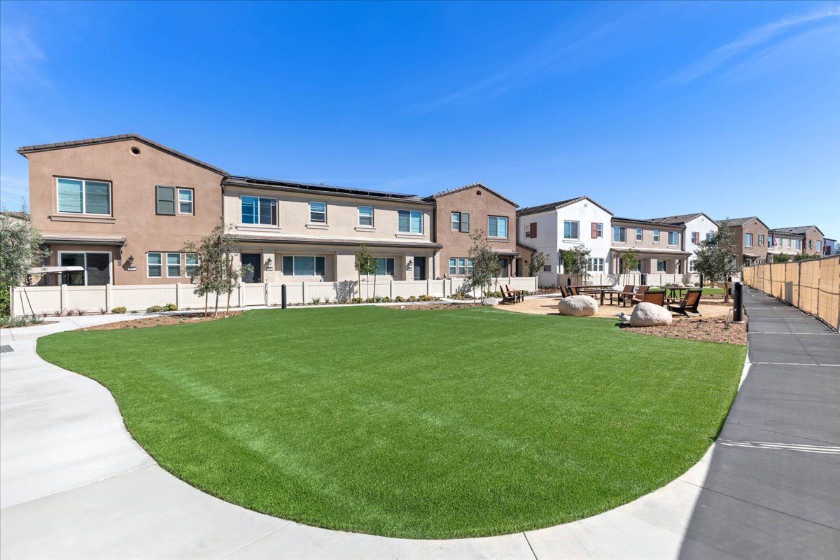 A large building with a lawn in front of it.