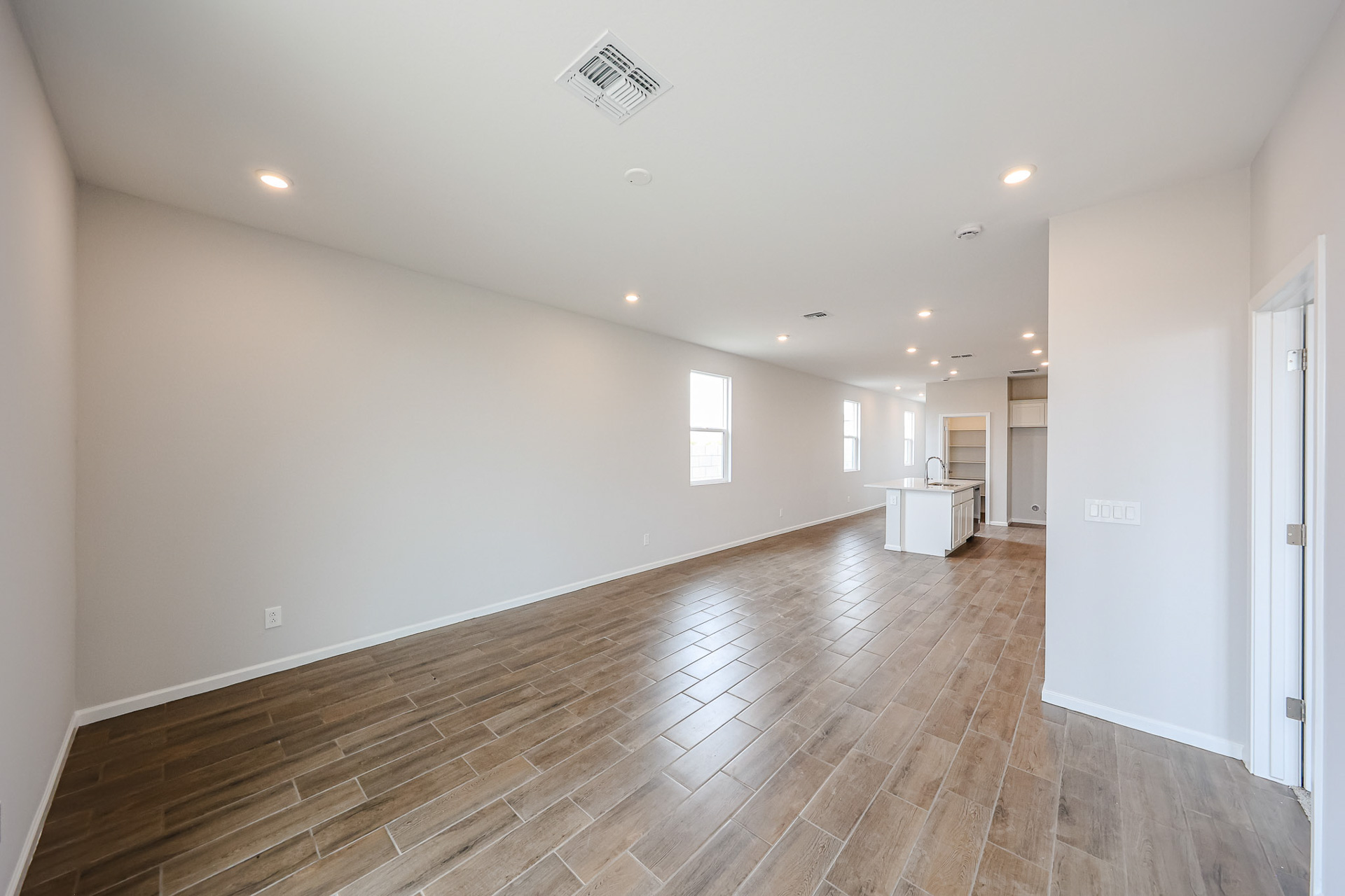 A long hallway with white walls.