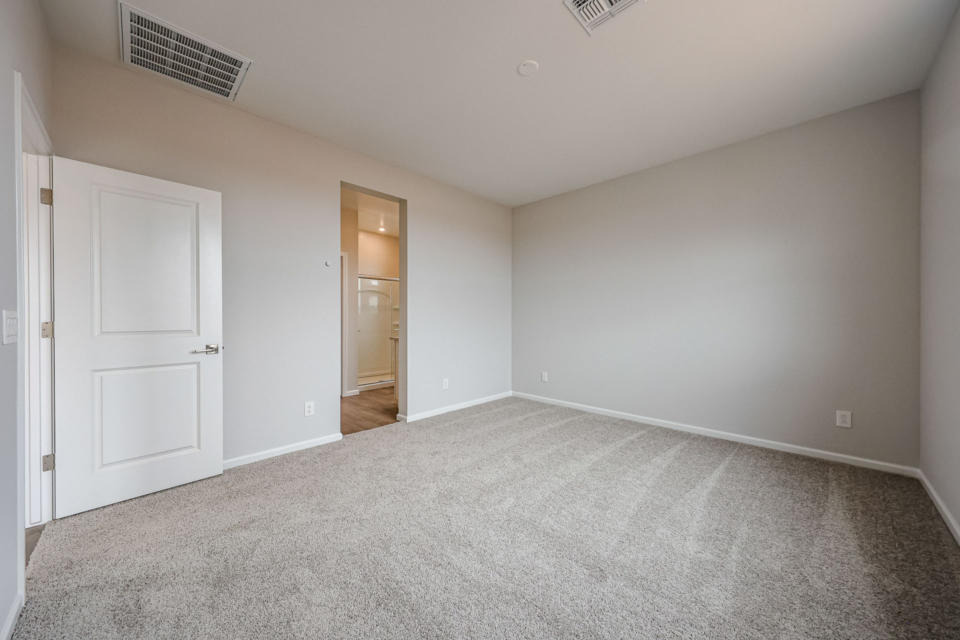 A hallway with white doors.