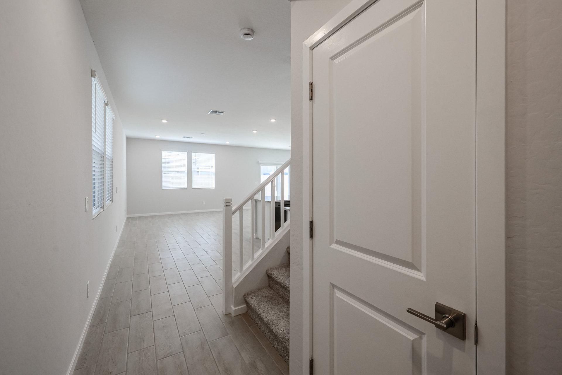 A hallway with white doors.