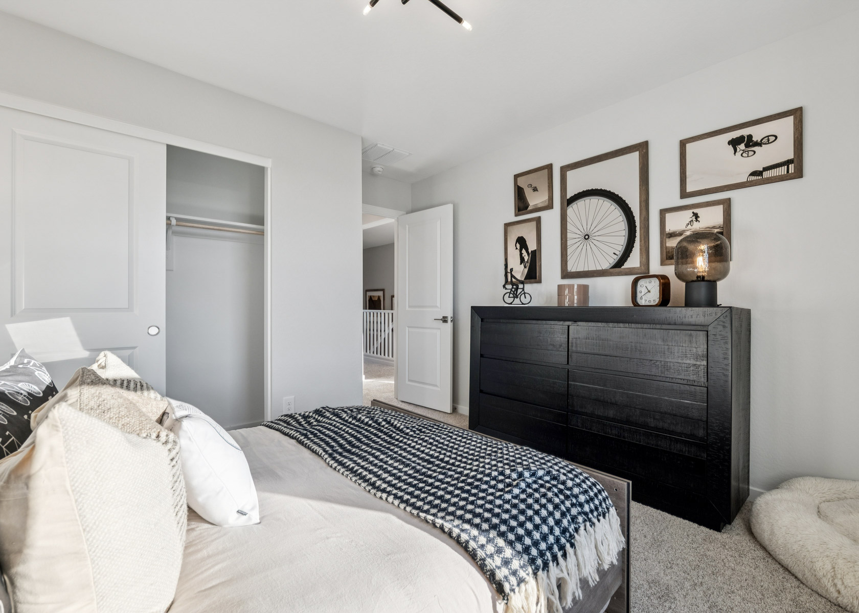A bedroom with a bed and a fireplace.