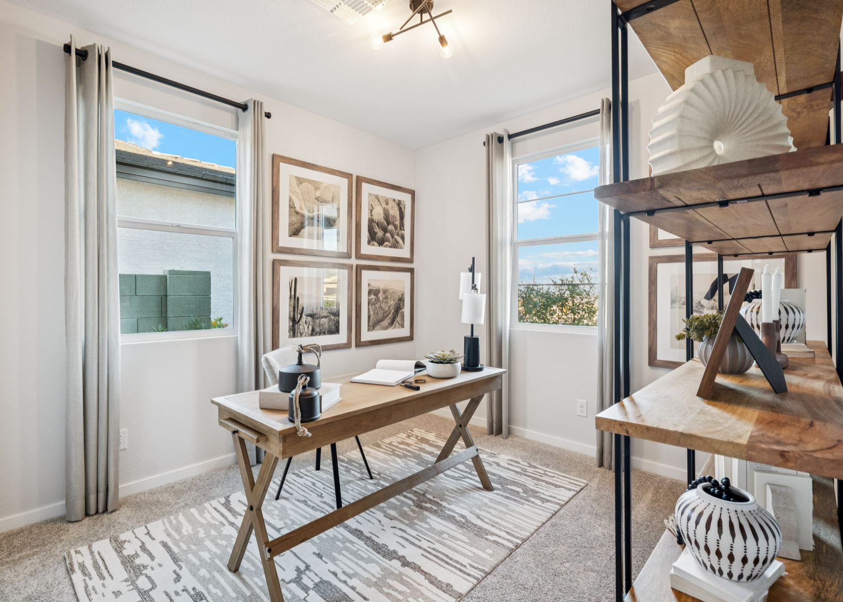 A room with a table and a rug and a rug.