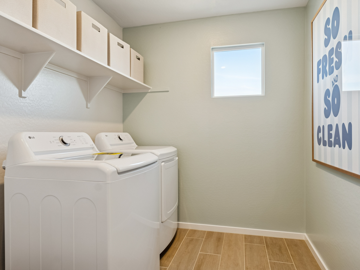 A room with a white wall and a white cabinet with a white window.