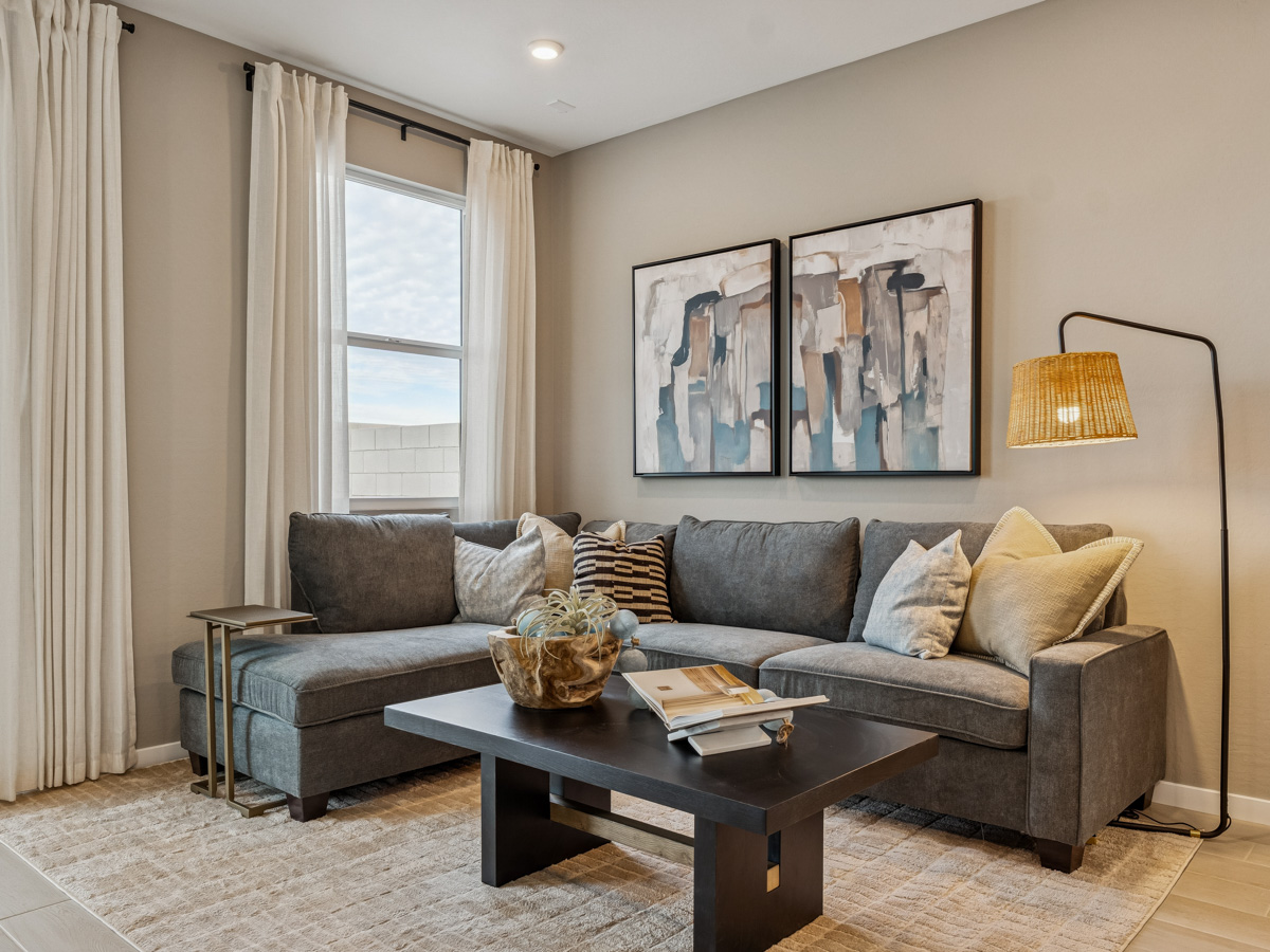 A living room with a couch and a coffee table.