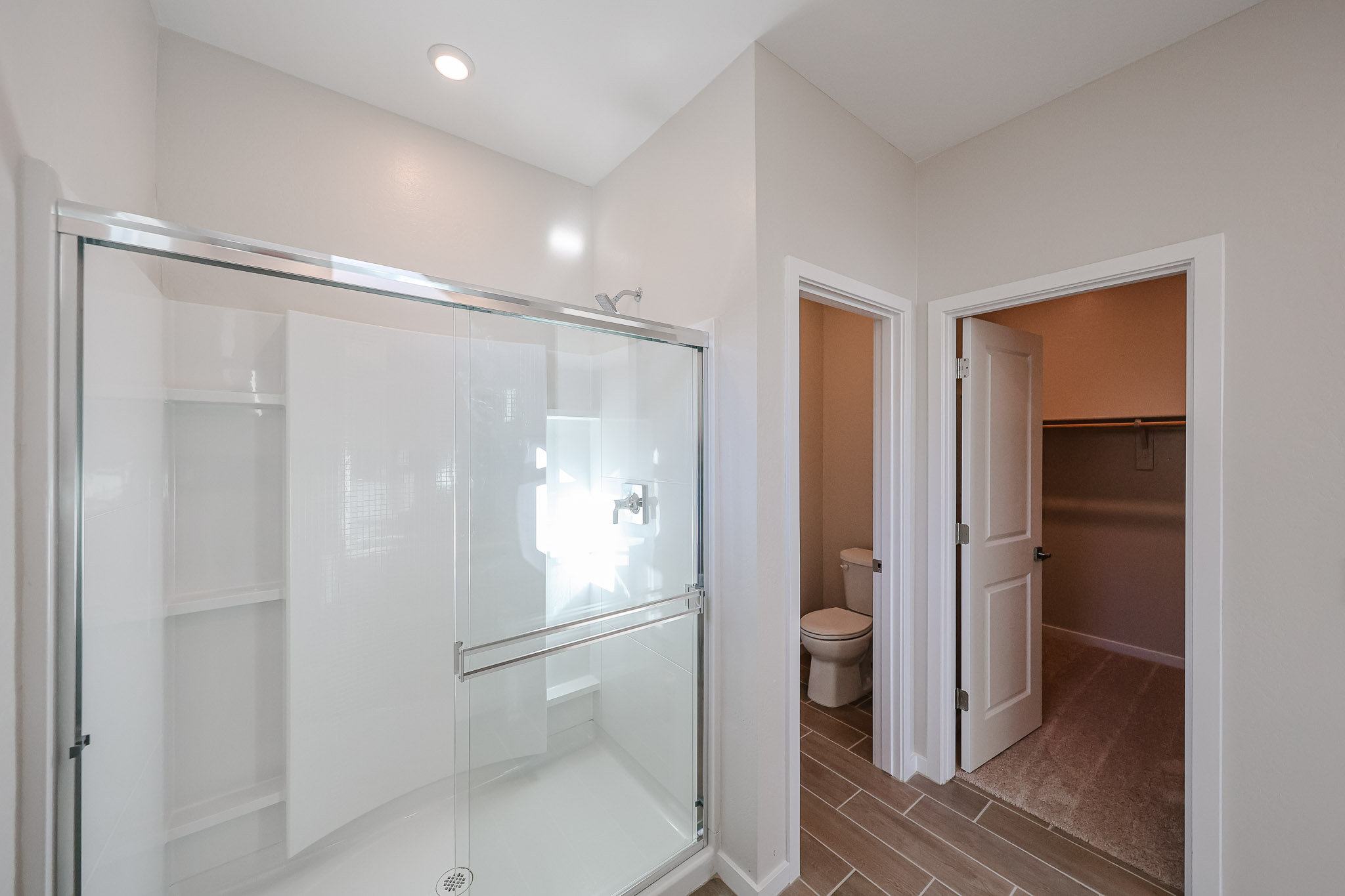 A bathroom with a glass shower.