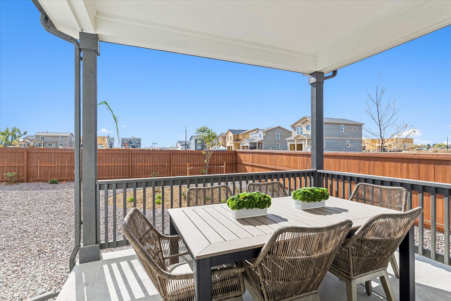 A table and chairs on a deck.