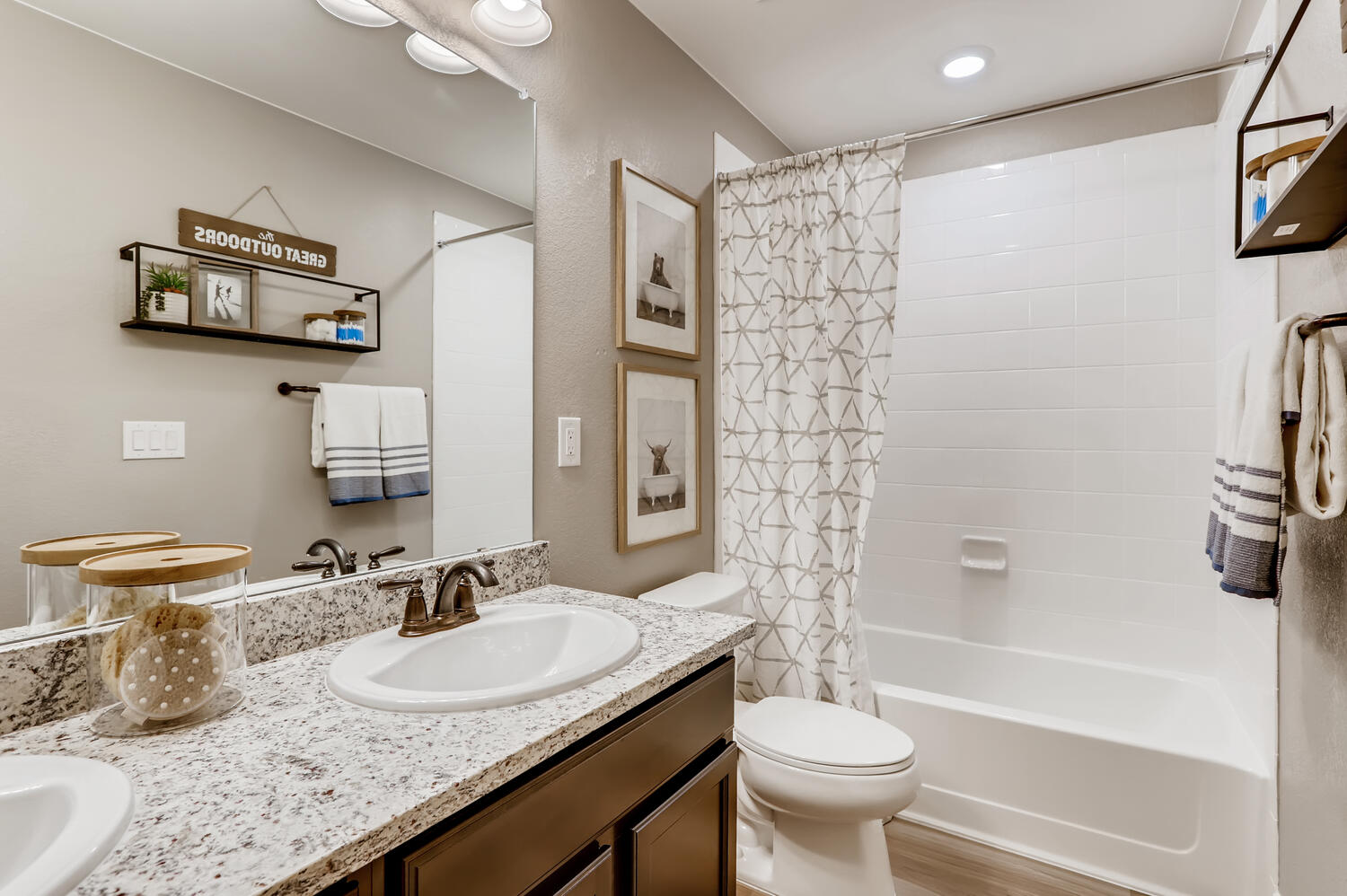 A bathroom with a marble countertop.