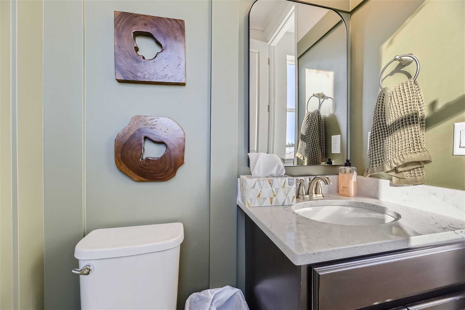 A bathroom with a toilet and sink.