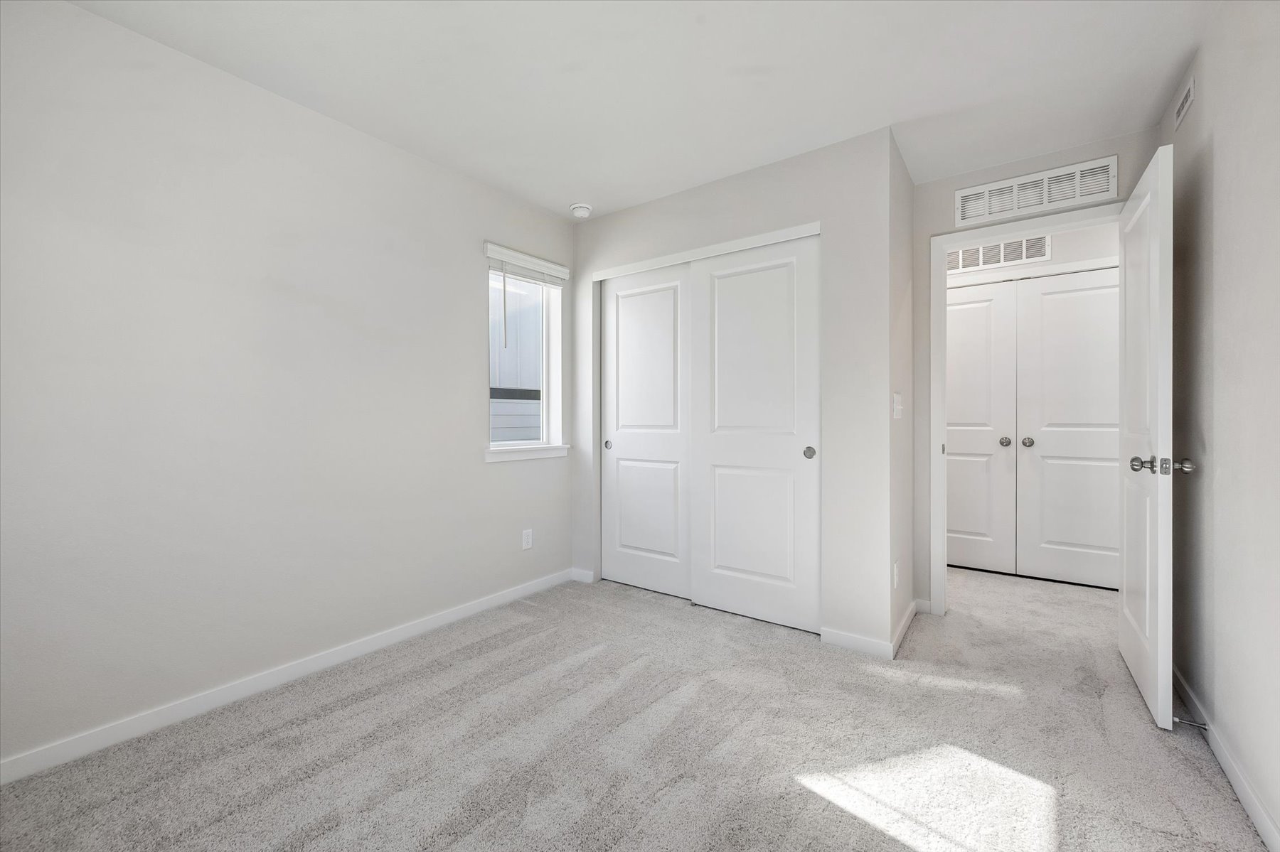 A room with white doors.