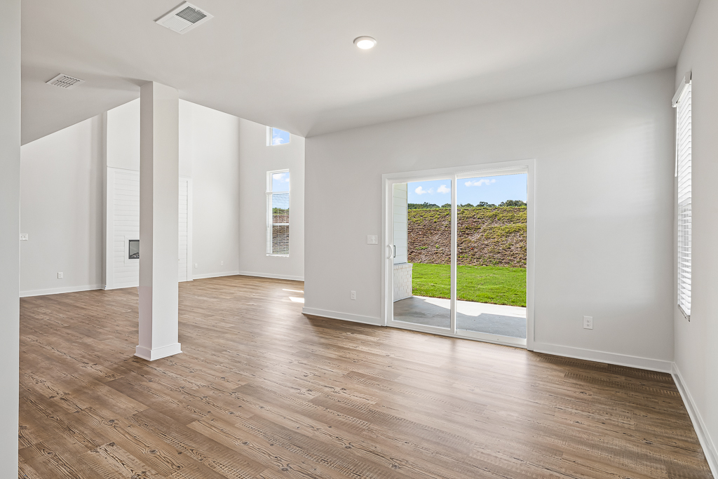 A room with a wood floor and a wood floor.