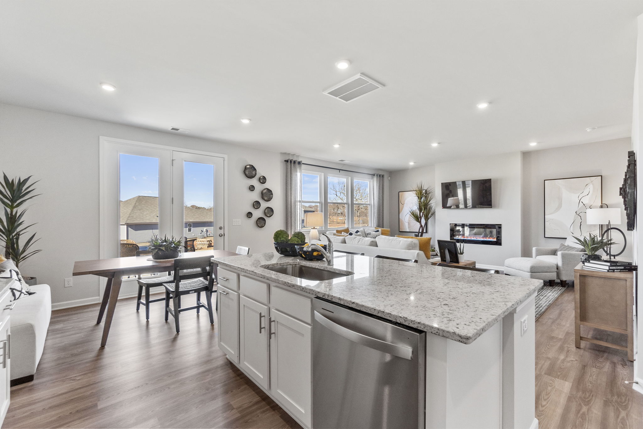 A kitchen with a marble island.