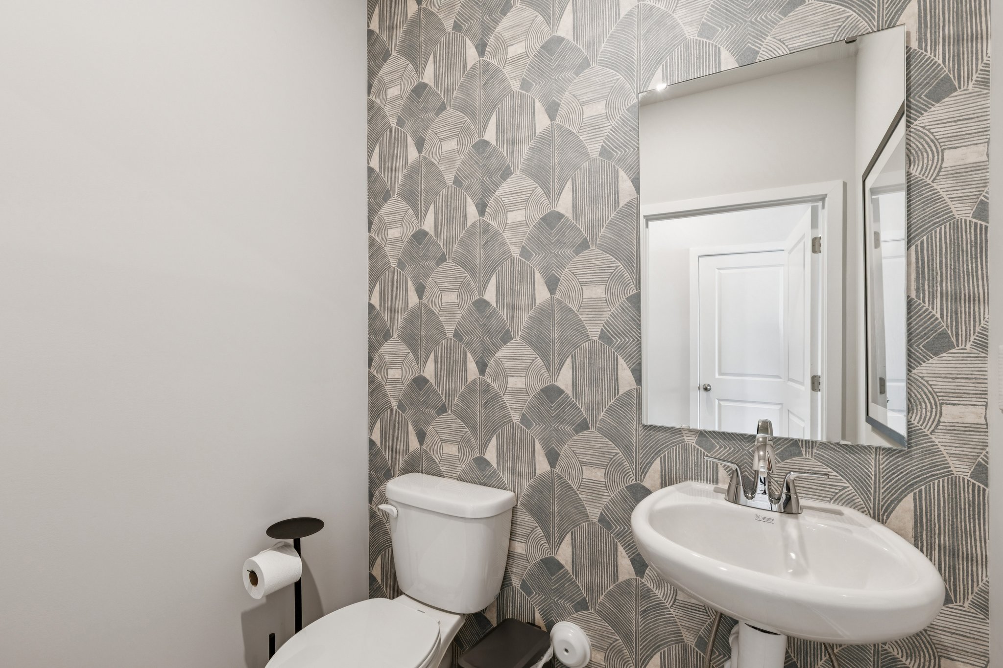 A bathroom with a sink and toilet.