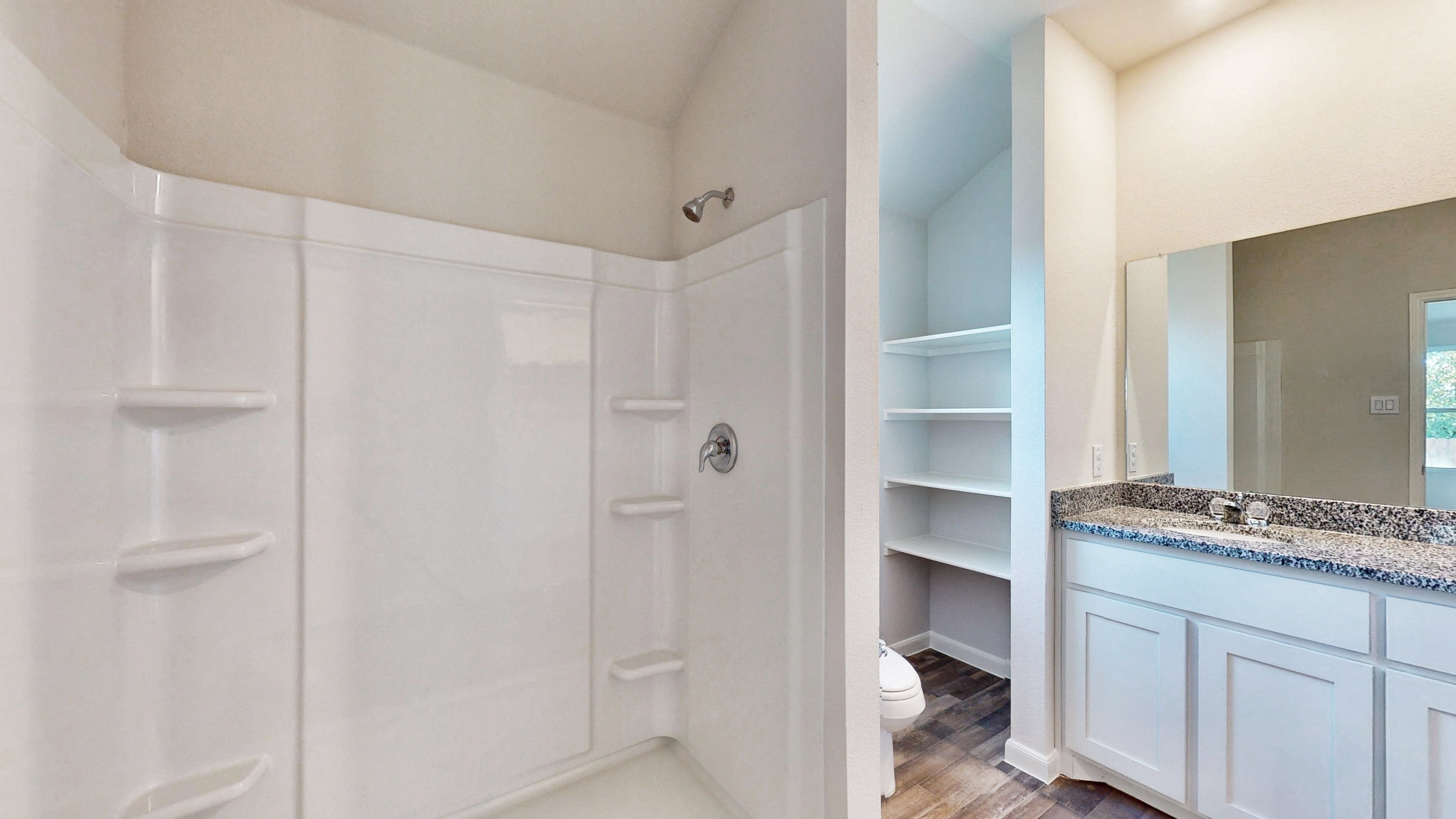 A bathroom with a glass shower.
