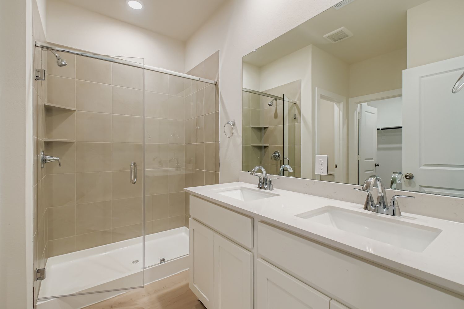 A bathroom with a glass shower.