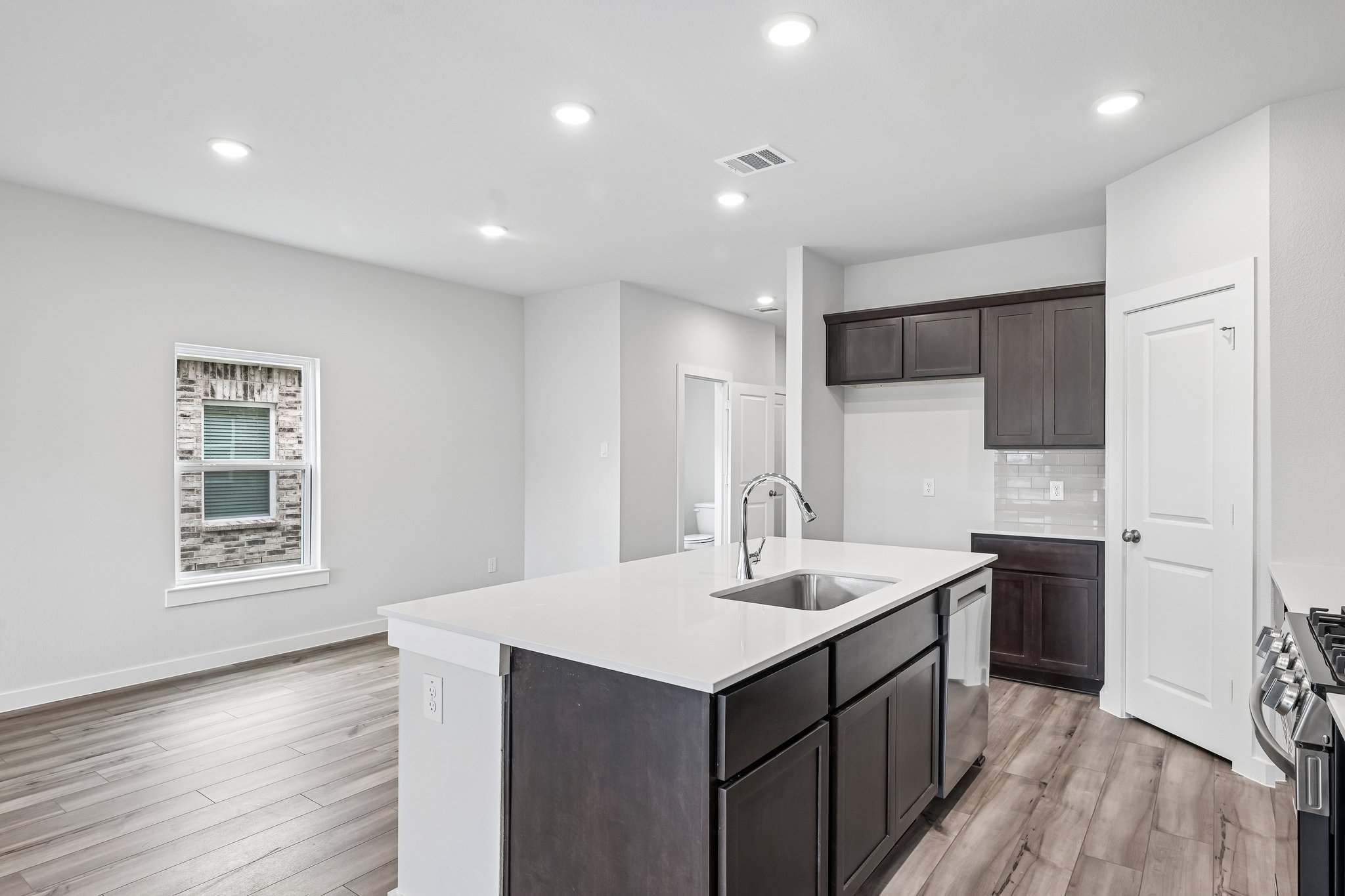 A kitchen with a sink and cabinets.