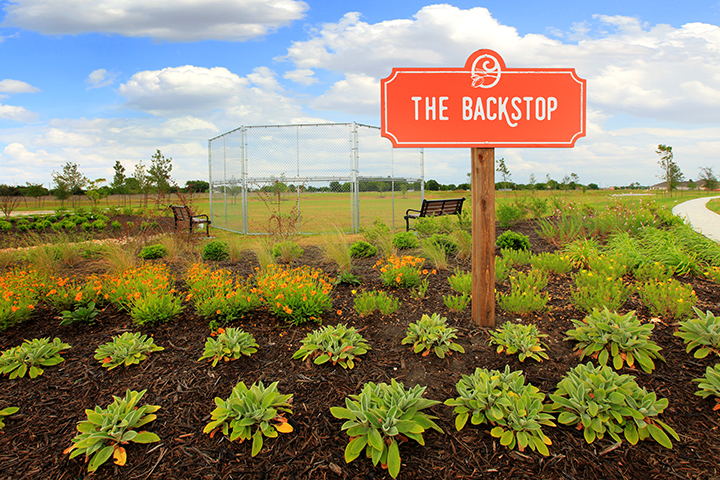 A sign in a garden.