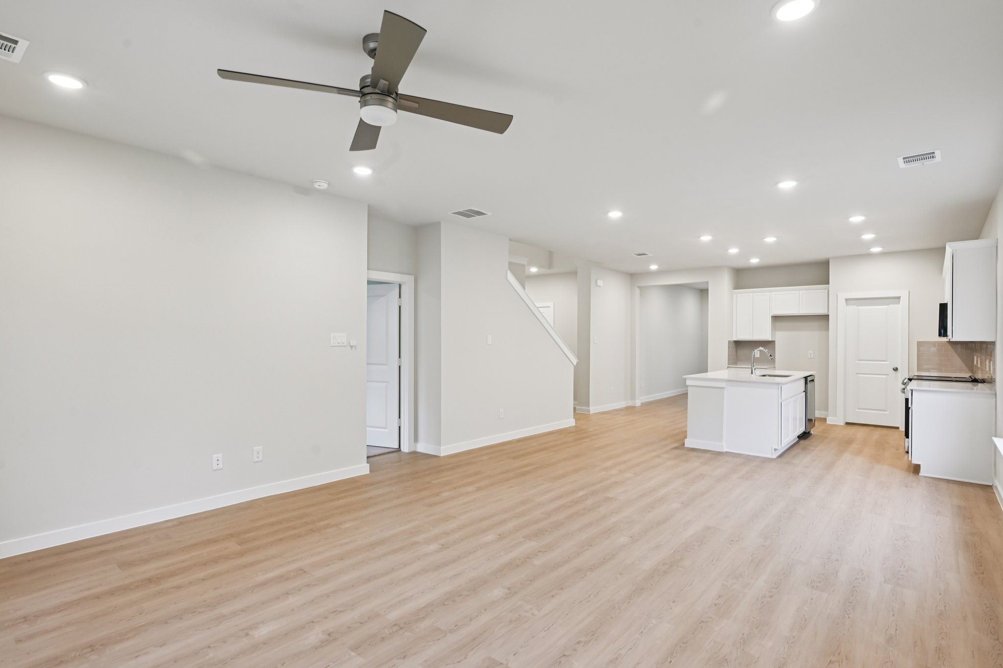 A large empty room with white walls.