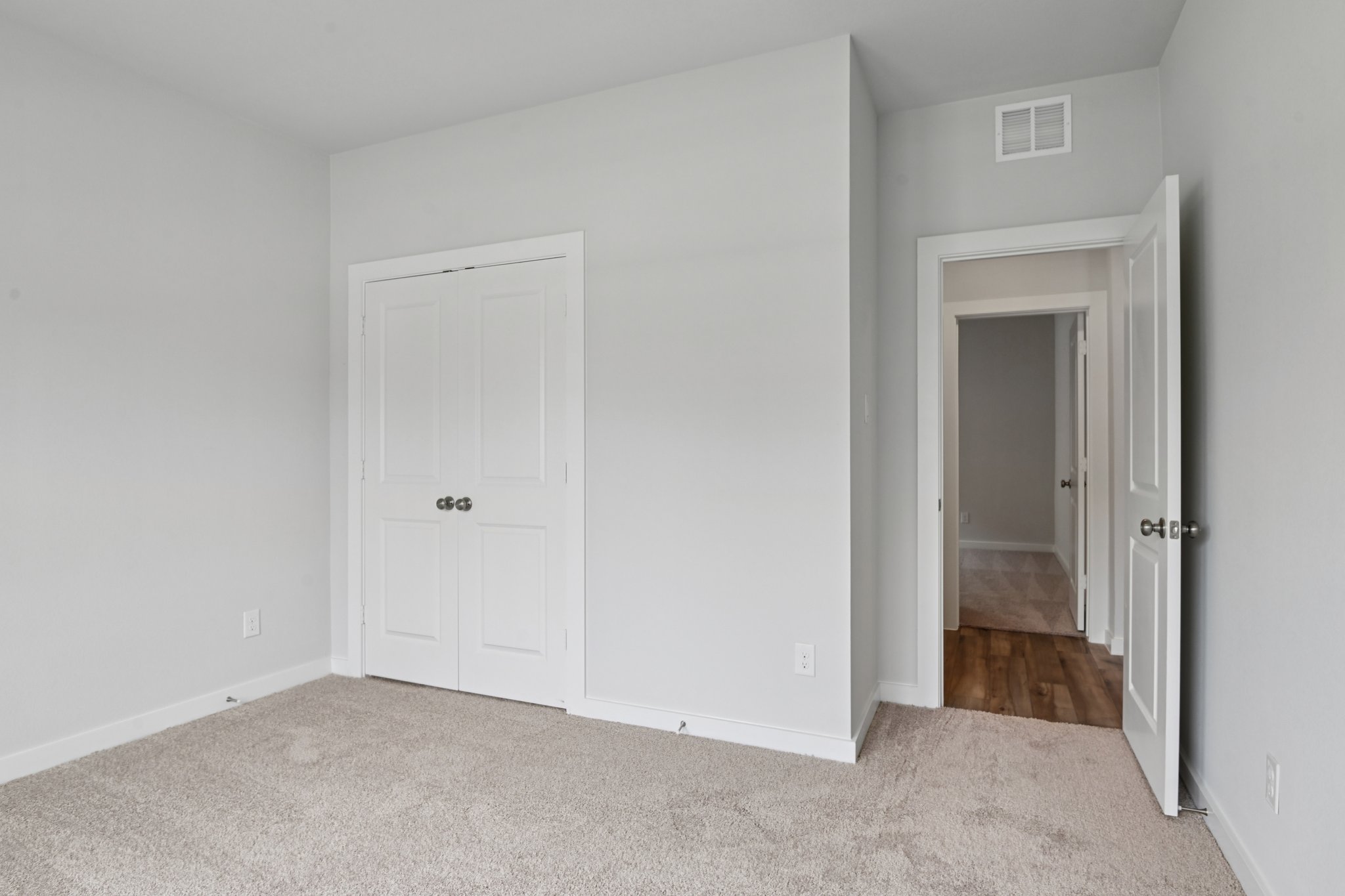A room with white doors.