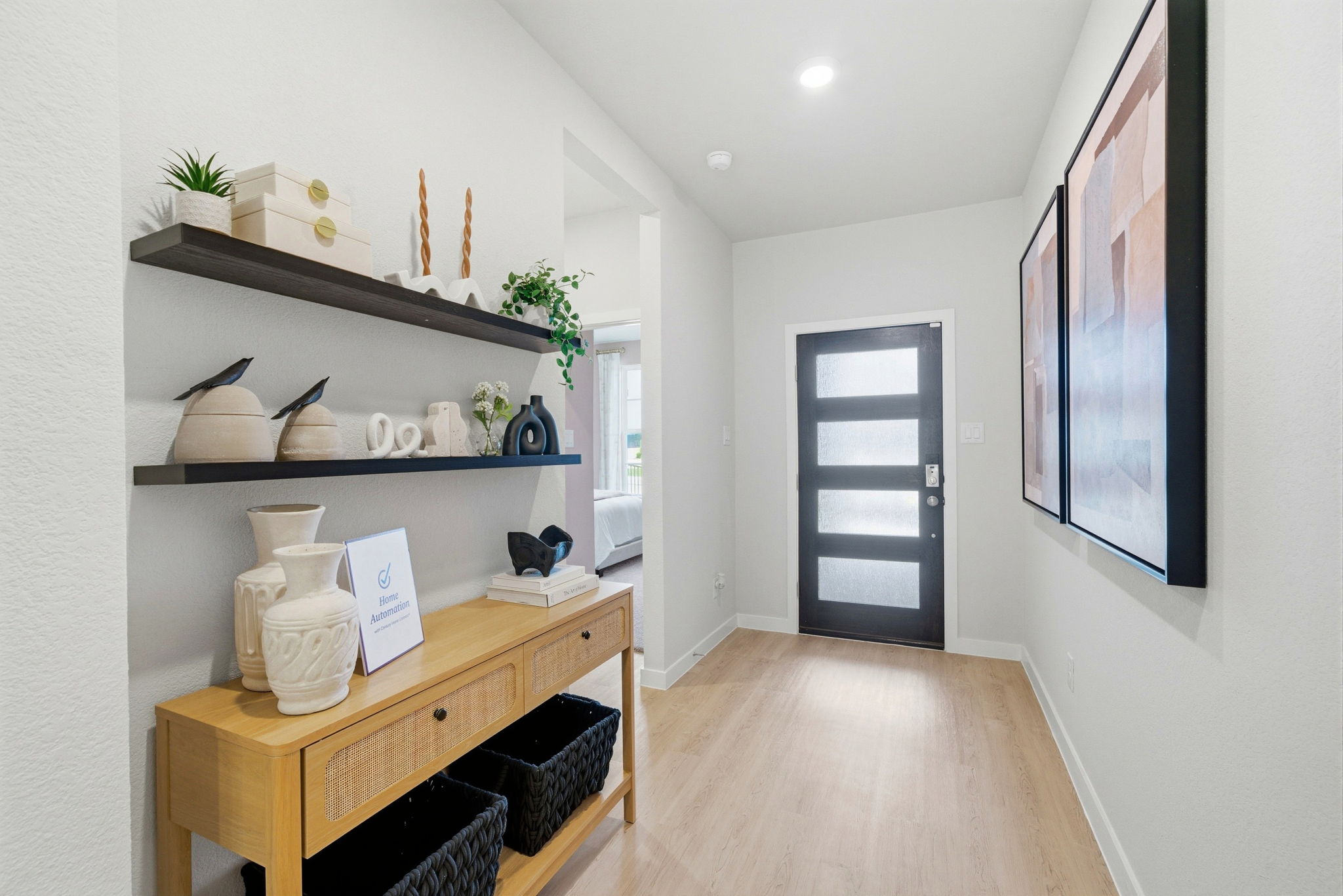 A room with a table and shelves.