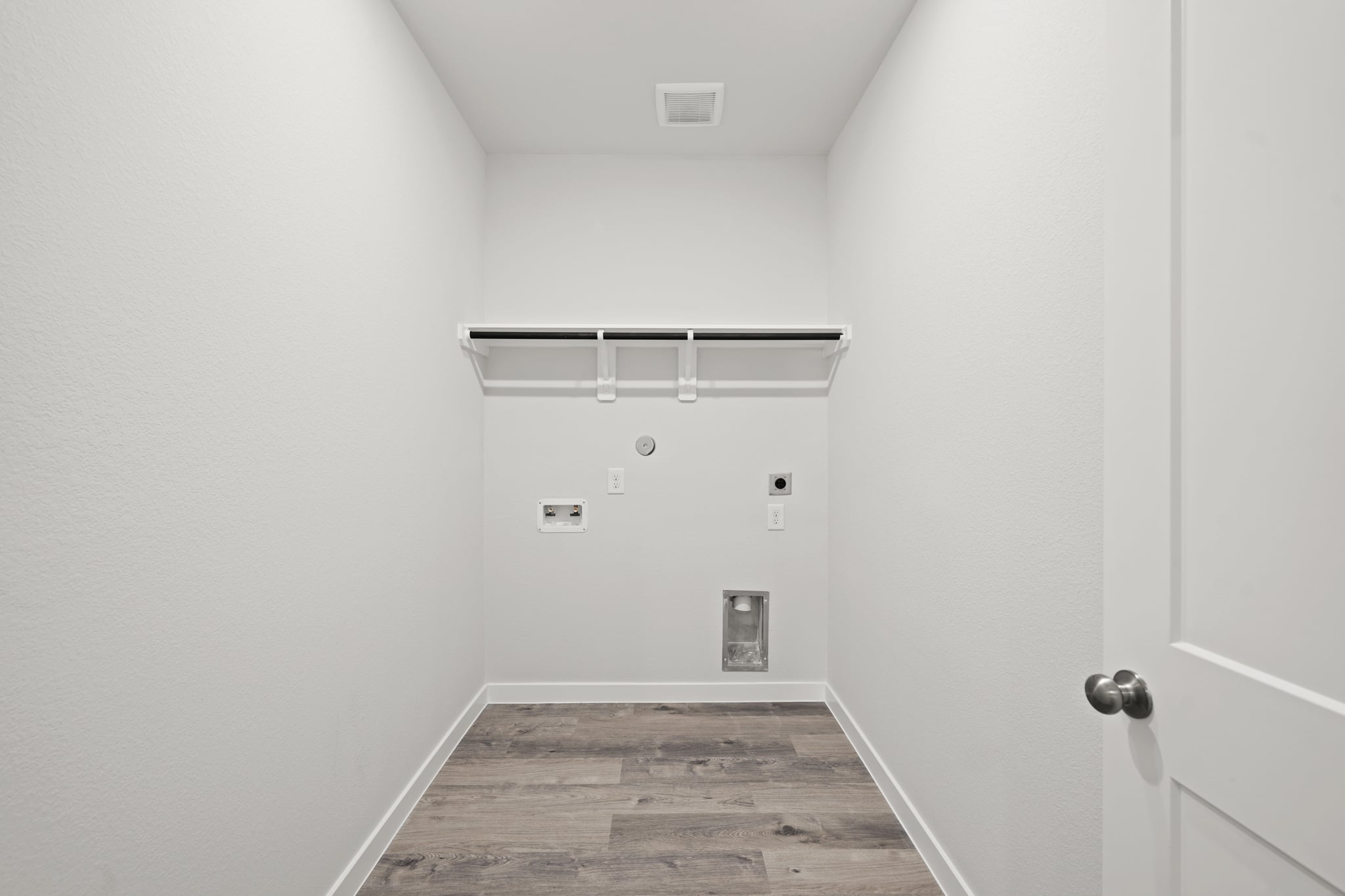 A hallway with white doors.