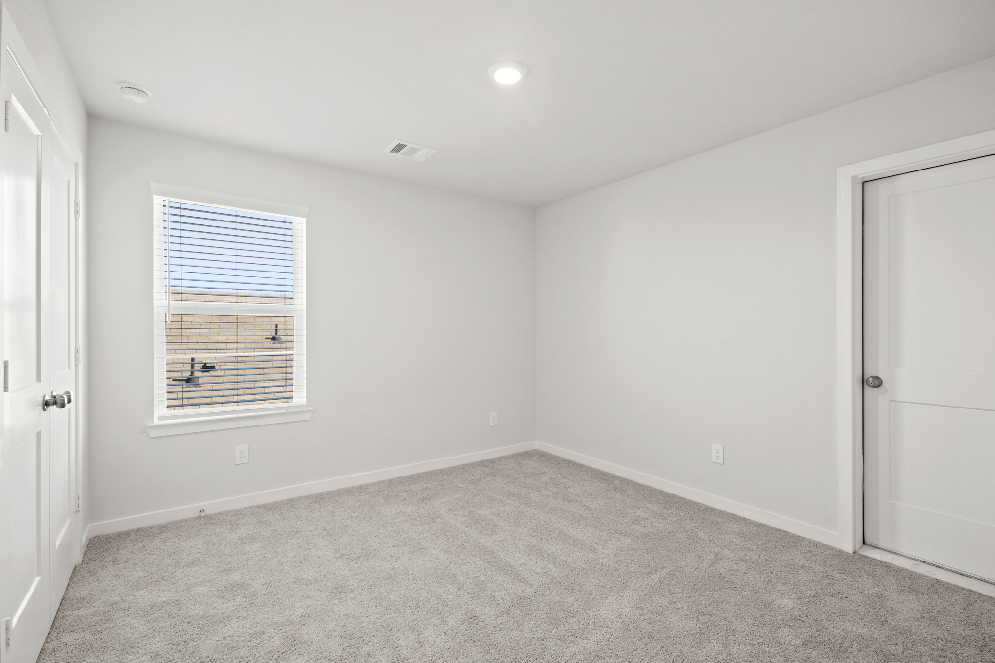 A room with a door and a window.