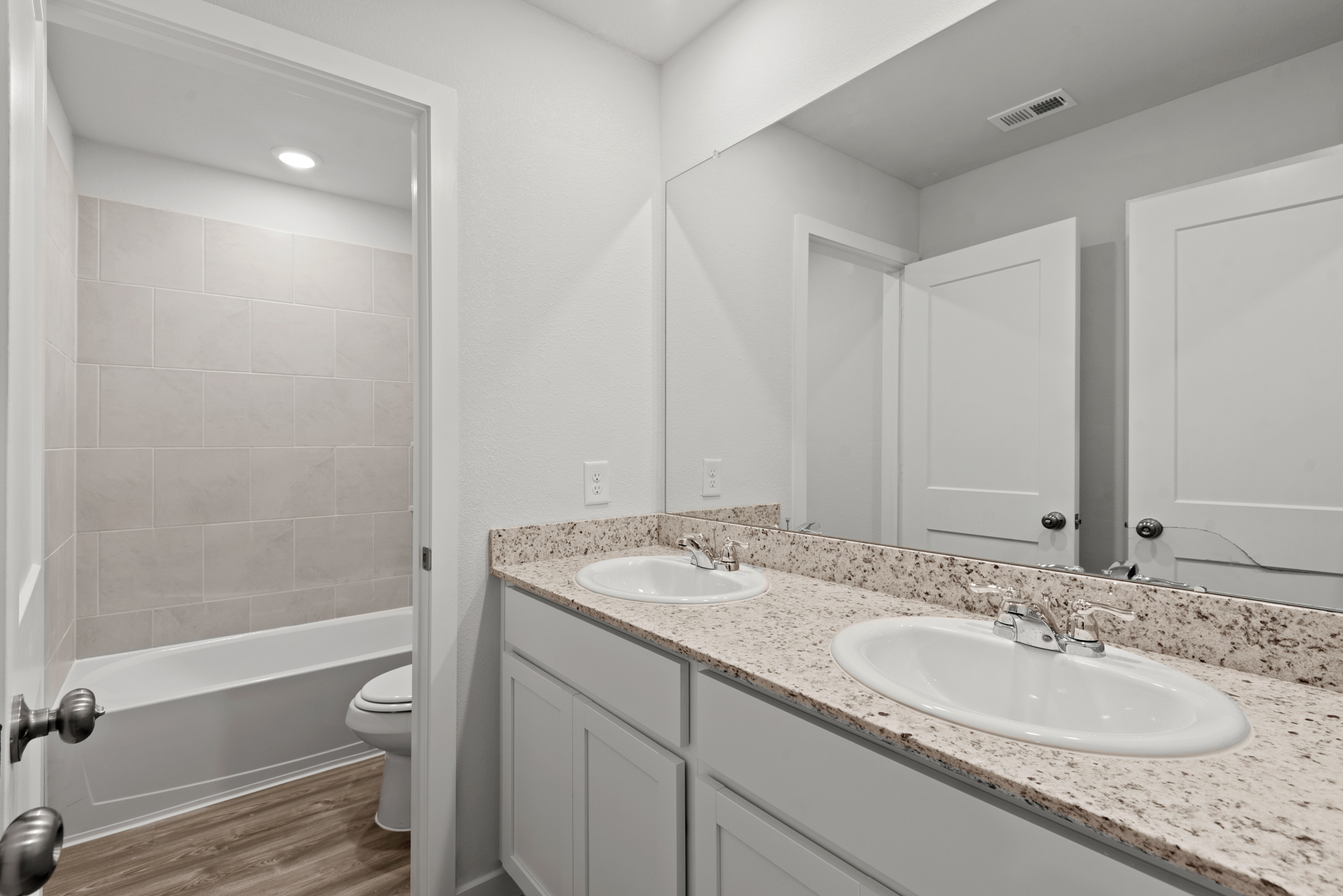 A bathroom with a sink and a tub.