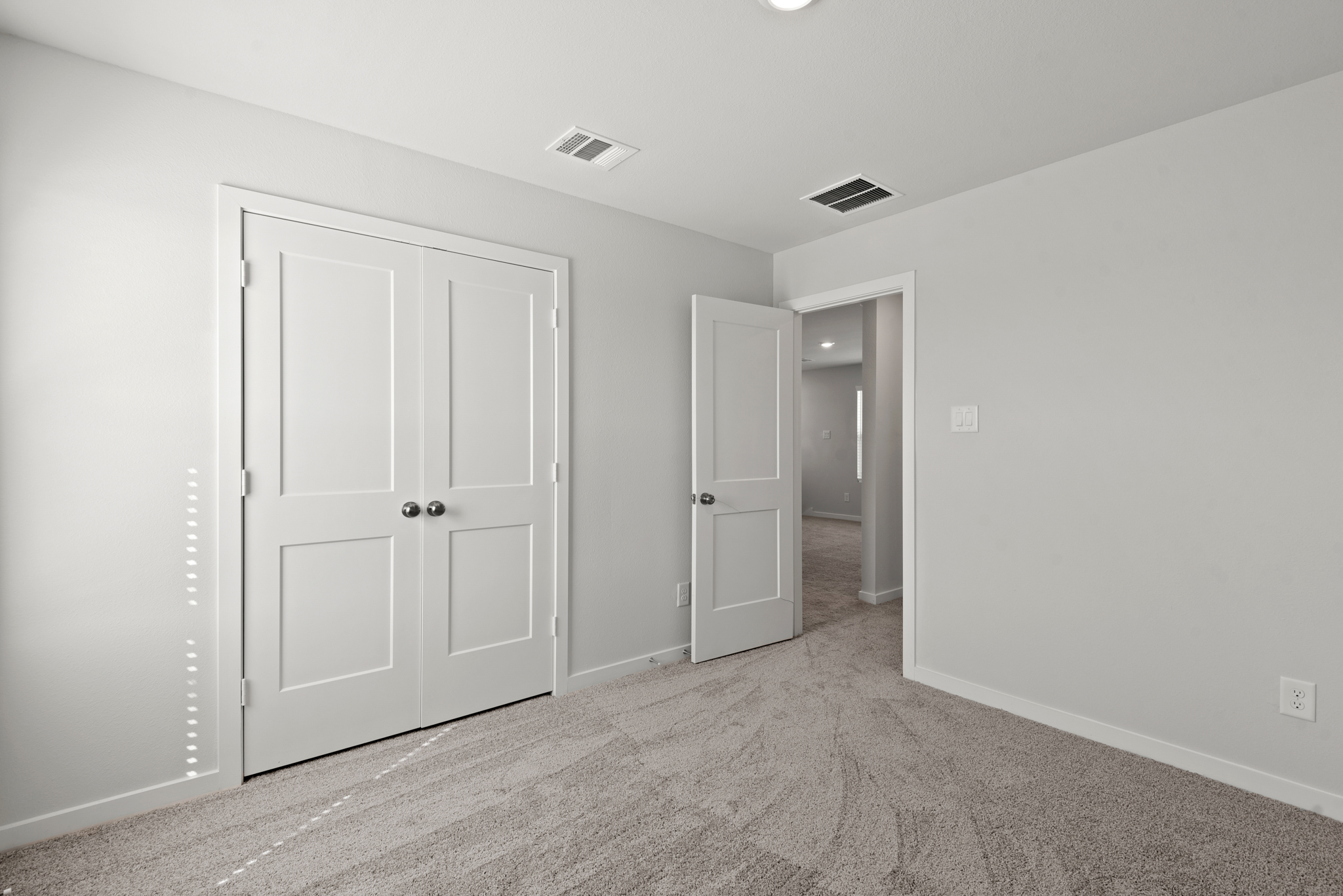 A room with white doors.