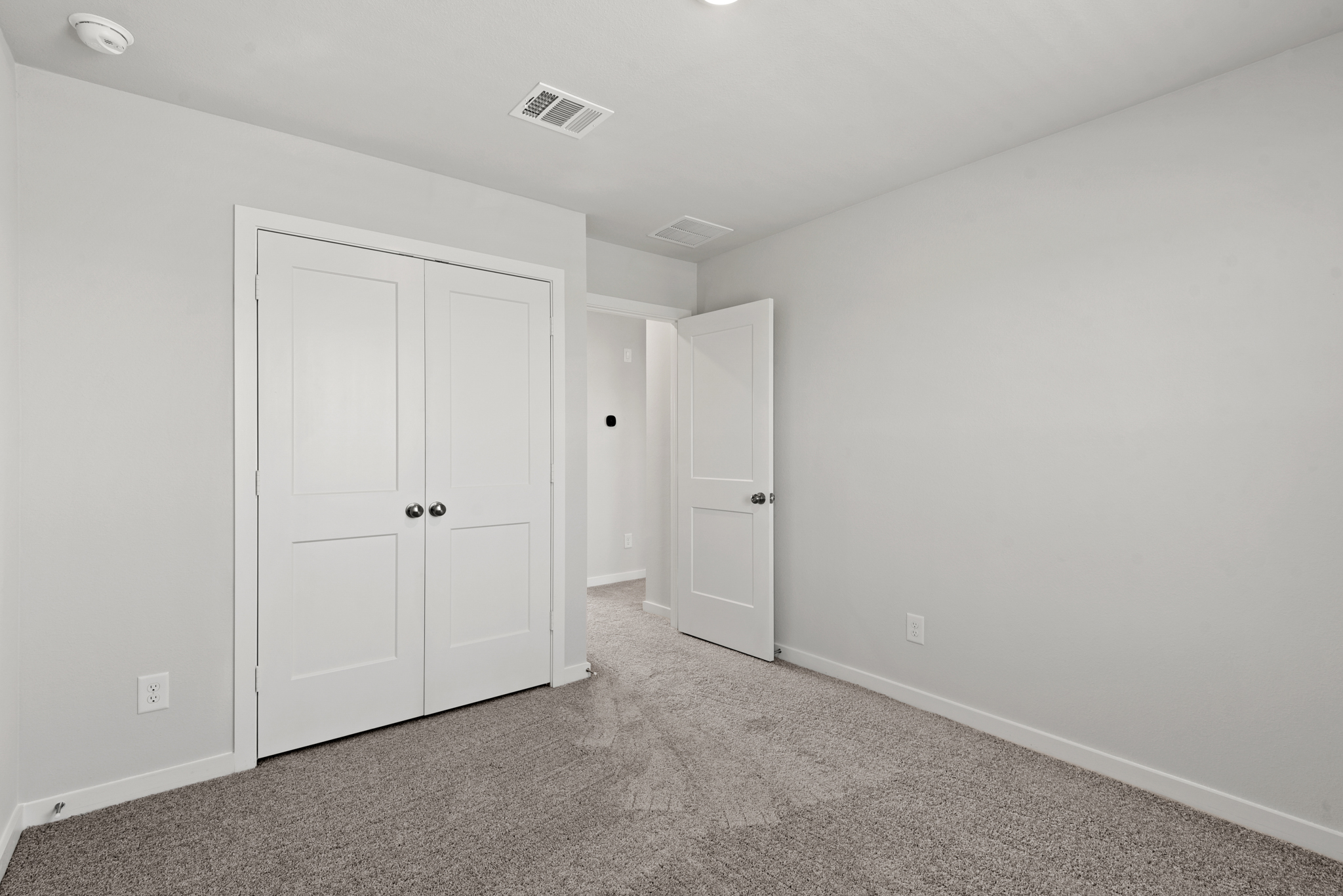 A room with white doors.