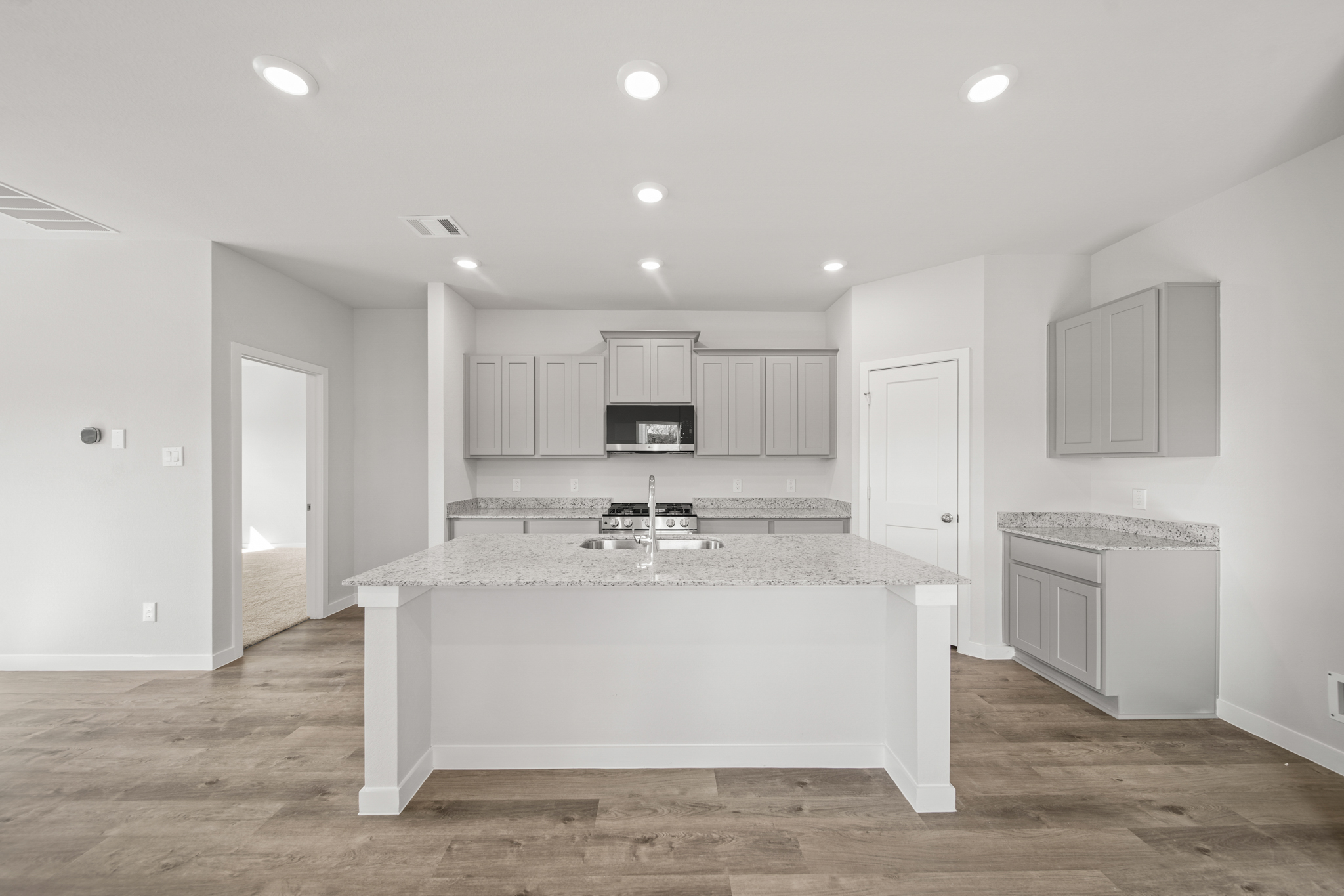 A large kitchen with a large island.