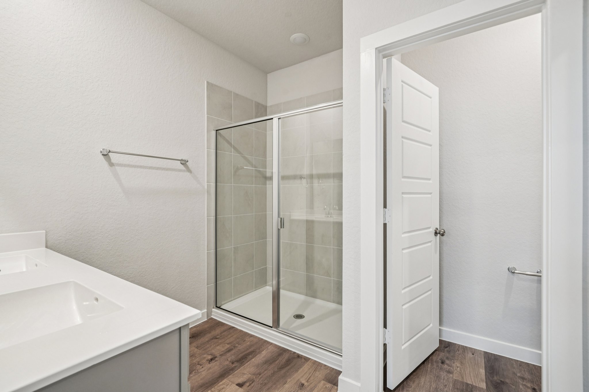 A bathroom with a glass shower.