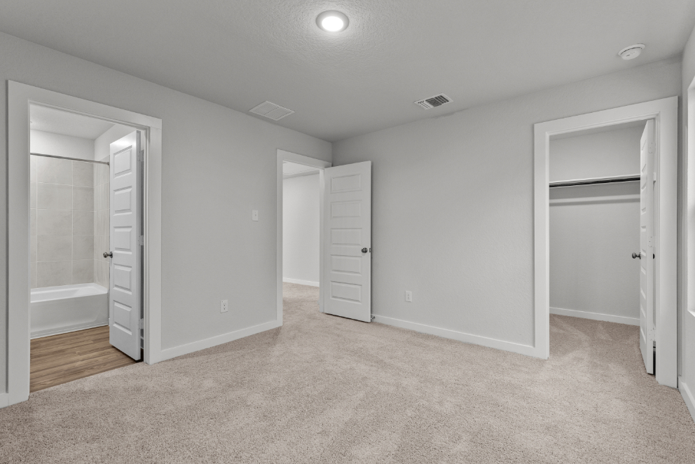 A room with white cabinets.