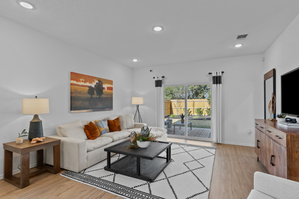 A living room with a large glass door.
