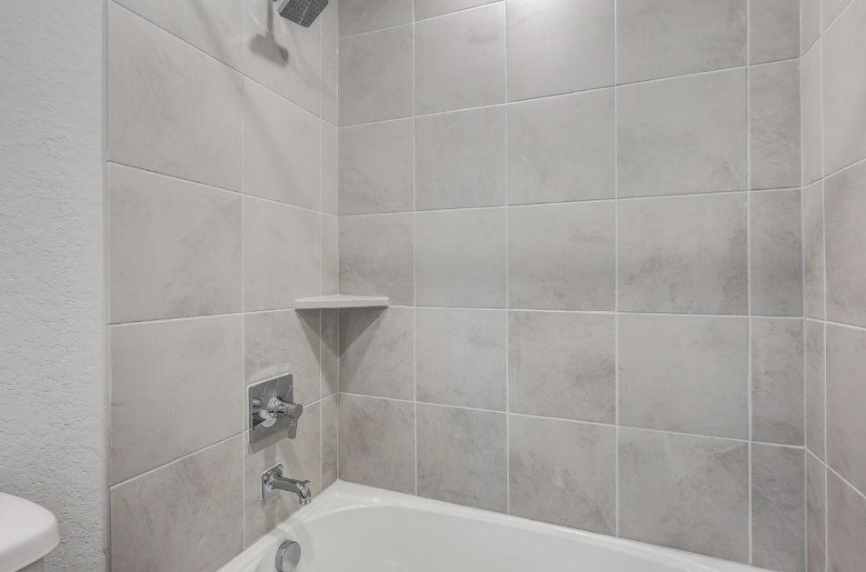 A white tiled bathroom.