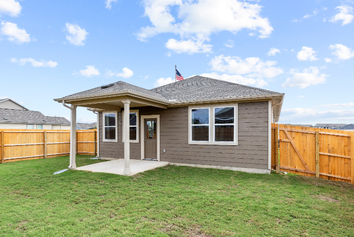 A small house with a fence.