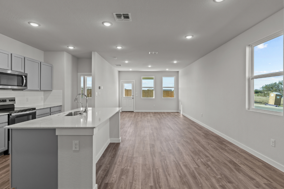 A kitchen with white walls.