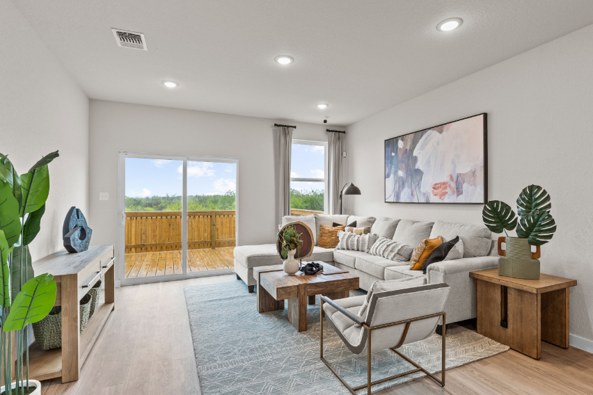 A living room with a large glass door.