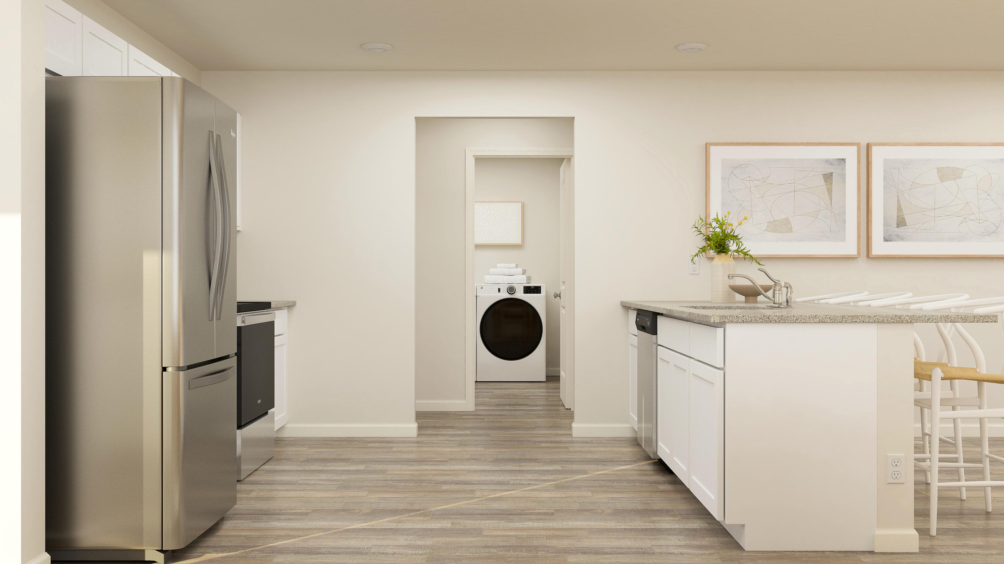 A kitchen with white cabinets.