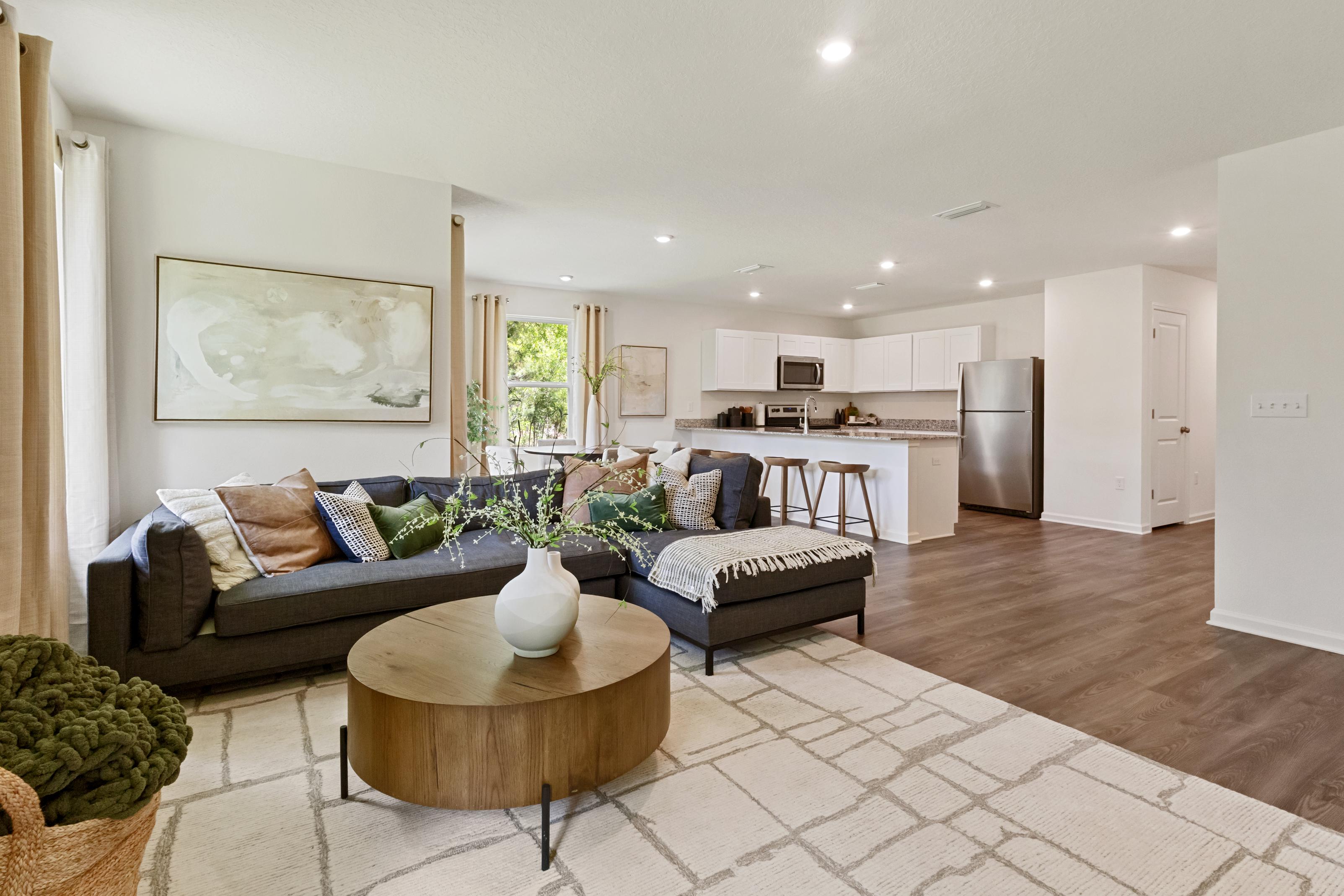 A living room with a couch and a table.