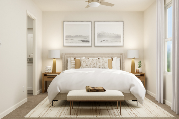 A bedroom with a bed and lamps.