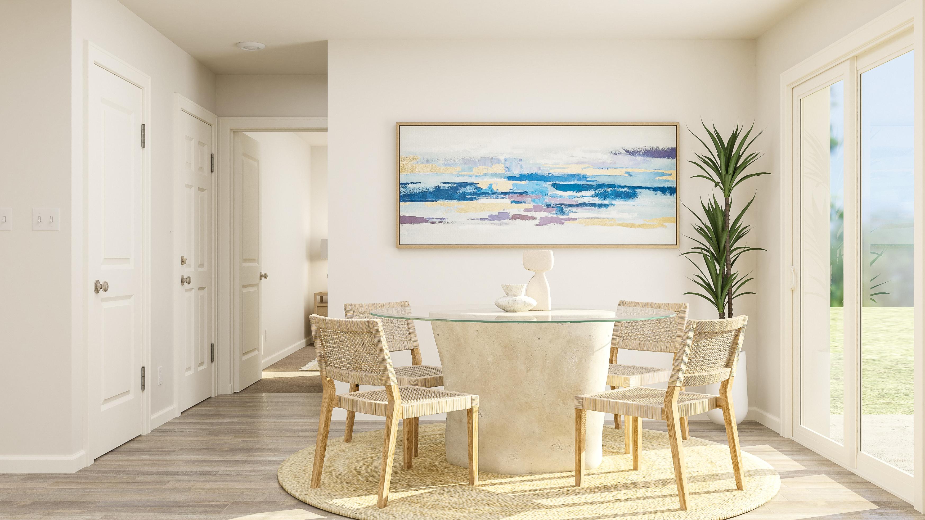 A dining room with a table and chairs.