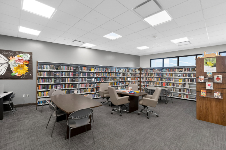 A room with a table and chairs.