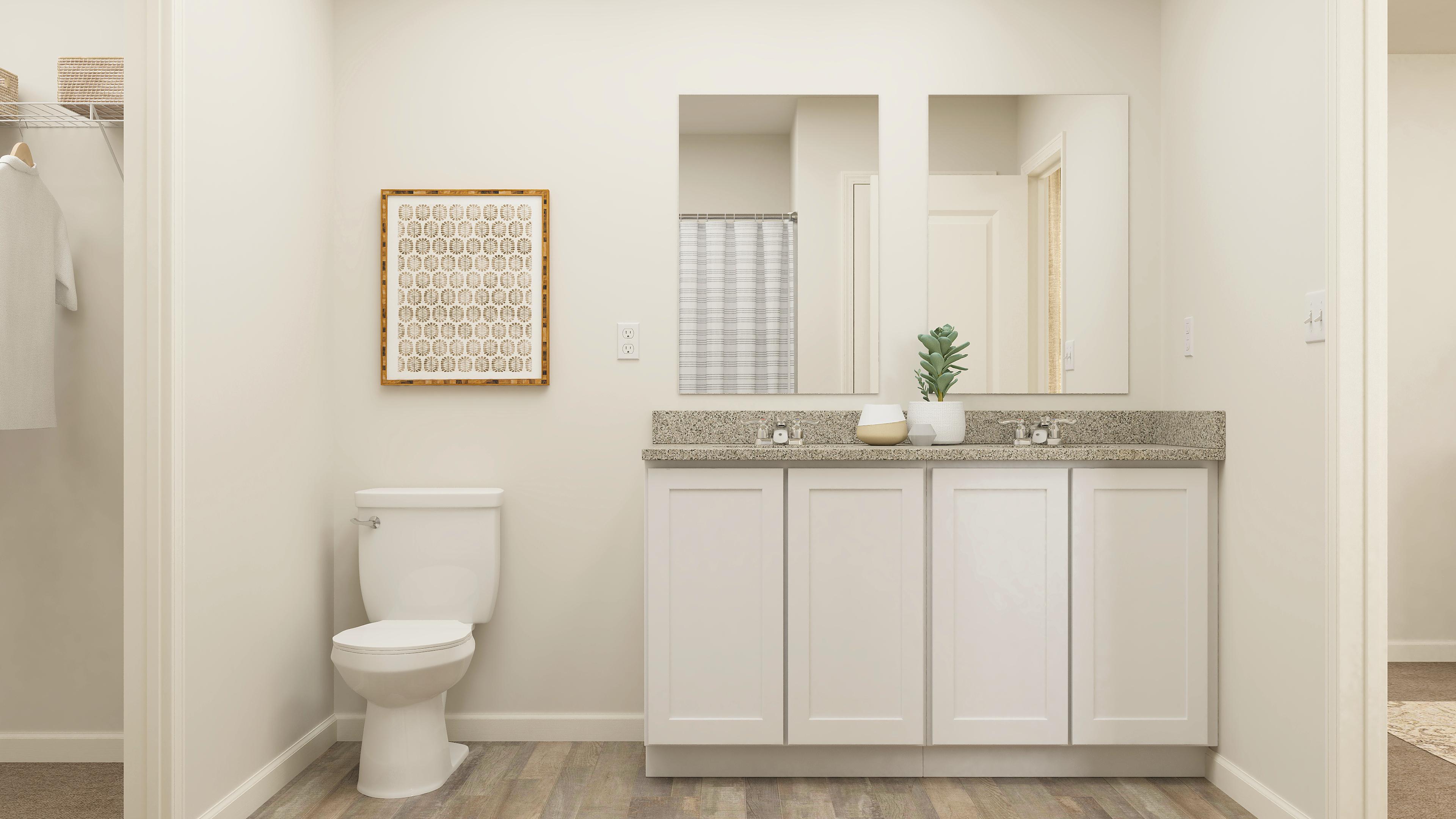 A bathroom with a toilet and sink.